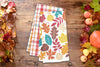 Fall Leaves & Plaid Kitchen Towel Set styled in a fall flat lay.
