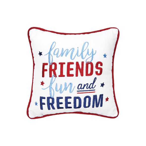 embroidered gift pillow with the words family friends fun and freedom embroidered surrounded by blue light blue and red stars and trimmed in red