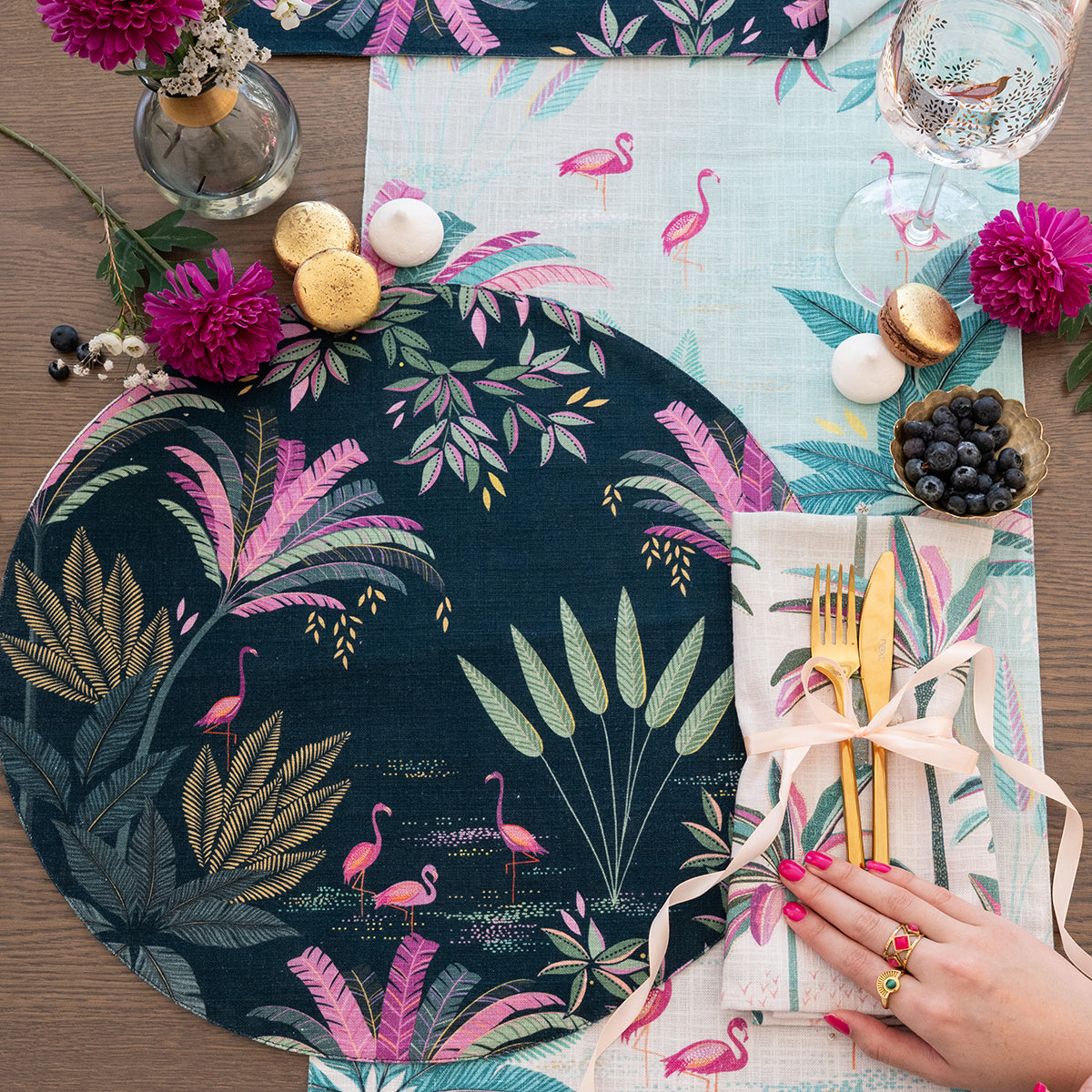 flamingo palms table linens table linens displayed as a coordinated tabletop setting.