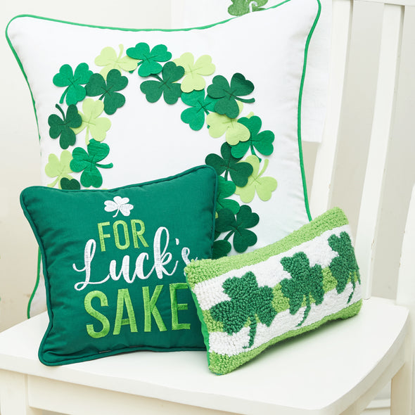 for lucks sake pillow with clover trio mini hooked pillow and the clover wreath pillow on a chair