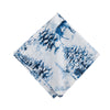 napkin with a blue watercolor inspired forest scene