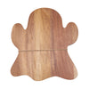 acacia wood serving board shaped like a ghost with an iron spreader