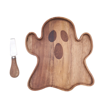 acacia wood serving board shaped like a ghost with an iron spreader