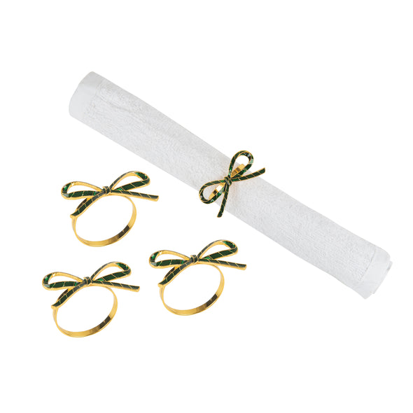 napkin rings shaped like green ribbons - one wrapped around a white napkin