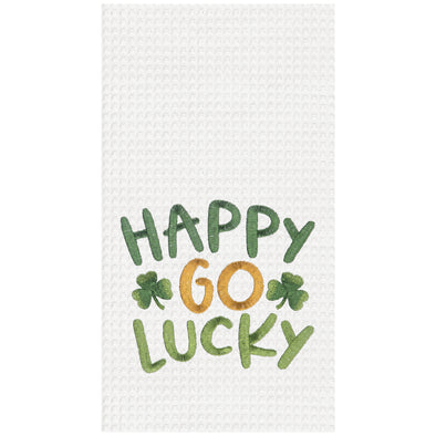 embroidered waffle weave towel with the words Happy Go Lucky surrounded by two clovers