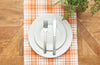 Hazel Plaid woven table runner styled with serve ware and greenery