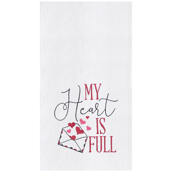 embroidered flour sack towel with the phrase my heart is full next to a letter bursting with pink hearts