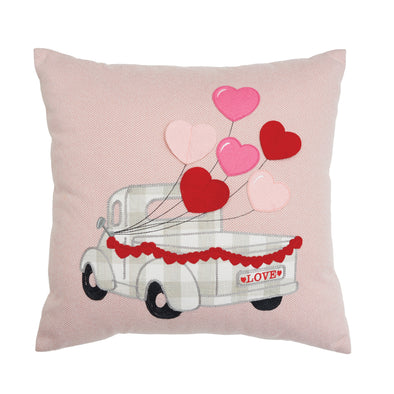 Applique plaid truck with pink and red heart balloons tied to the window, embroidered on a pink and white chevron background.