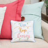 hip hop hooray pillow on a couch with a pink and blue pillow 