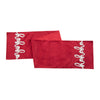 red embroidered table runner with the words ho ho ho on each end in white