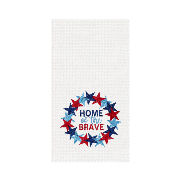 a waffle weave towel with the phrase Home of the Brave surrounded by a red and blue wreath of stars