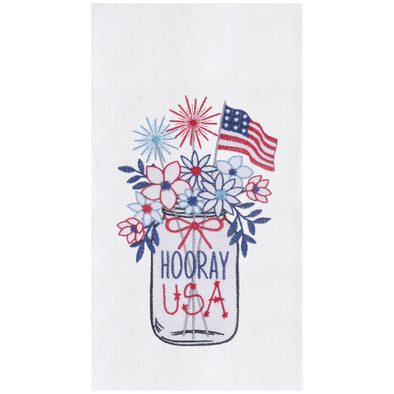 flour sack towel with a mason jar filled with flowers sparklers and an American flag with the words hooray USA