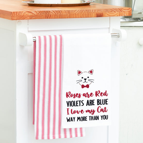 flour sack towel embroidered with a roses are red poem below a cat hanging from a kitchen counter