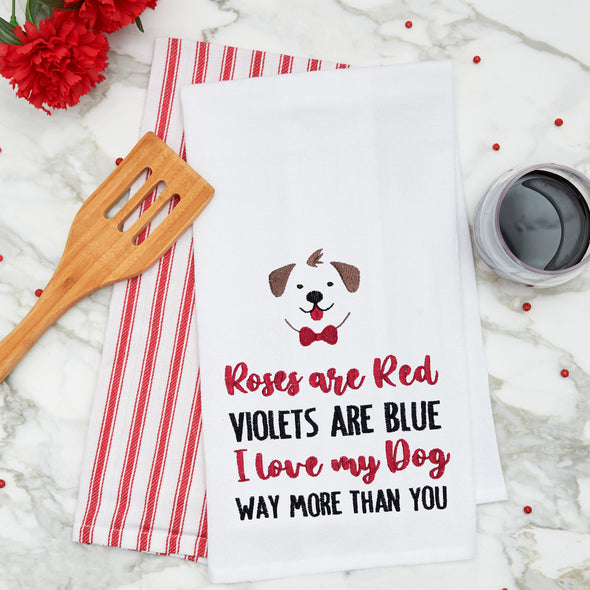 embroidered flour sack towel with a roses are red poem below a dog on a marble kitchen counter