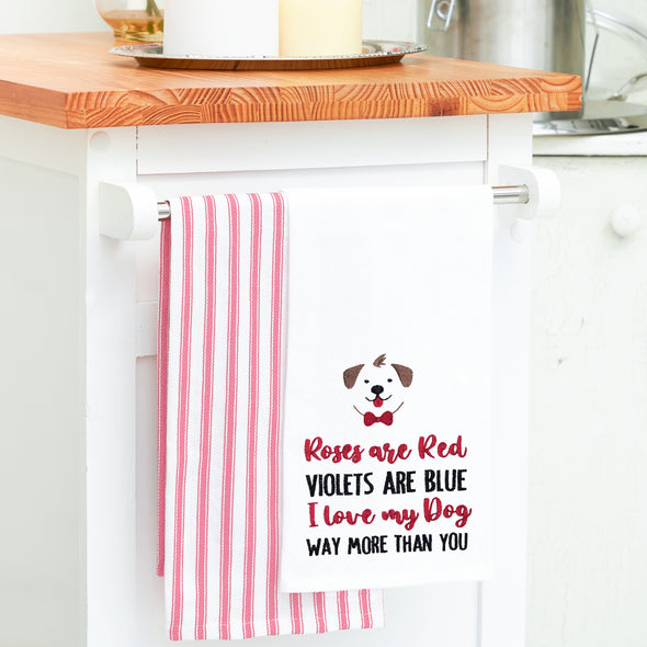 embroidered flour sack towel with a roses are red poem below a dog hanging from a kitchen counter