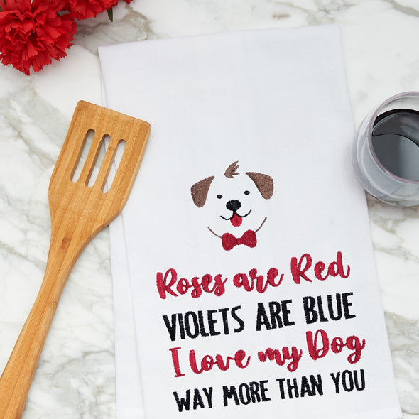 embroidered flour sack towel with a roses are red poem below a dog on a marble kitchen counter