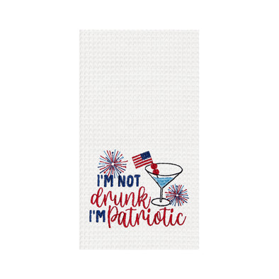 embroidered waffle weave towel with witty saying of "I'm not drunk I'm patriotic" surrounded by a martini cocktail and fireworks