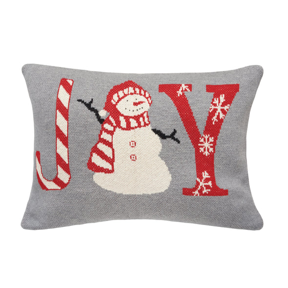 knitted pillow with a grey background and the word joy in red. the J looks like a candy cane, the O looks like a snowman wearing a red hat and scarf, and the Y is covered in white snowflakes