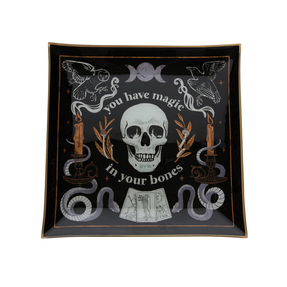 glass tray with the words you have magic in your bones surrounding a skull and other mystical icons including tarot cards snakes owls and candles