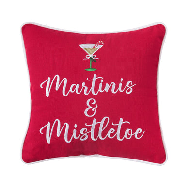 red pillow trimmed in white and embroidered with the words martinis and mistletoe below a martini glass decorated with a candy cane