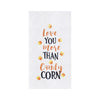 flour sack towel with embroidered love you more than candy corn phrase surrounded by candy corn pieces