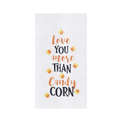 flour sack towel with embroidered love you more than candy corn phrase surrounded by candy corn pieces