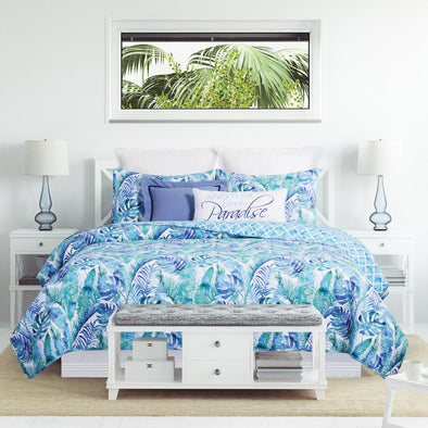 The Palazzo Quilt Set styled in a tropical bedroom.