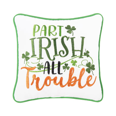 white pillow with a green border with the words "part irish all trouble" in green, black and orange with shamrocks floating around