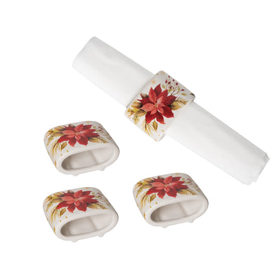 ceramic napkin rings with an image of a poinsettia and leaves