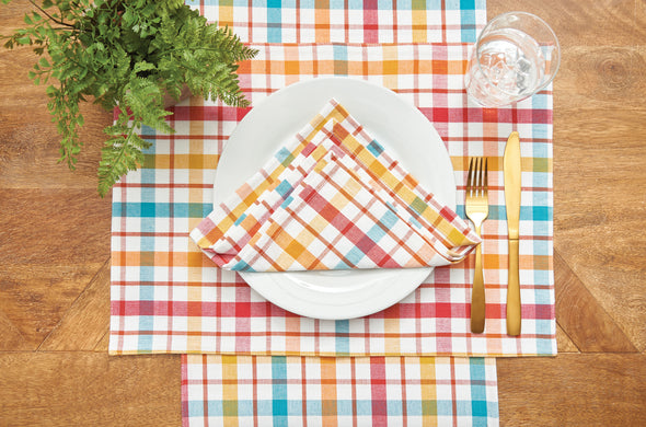 Radley Plaid woven table linen collection styled with serve ware and greenery. 