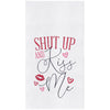 embroidered flour sack towel with the phrase shut up and kiss me surrounded by red lips and hearts