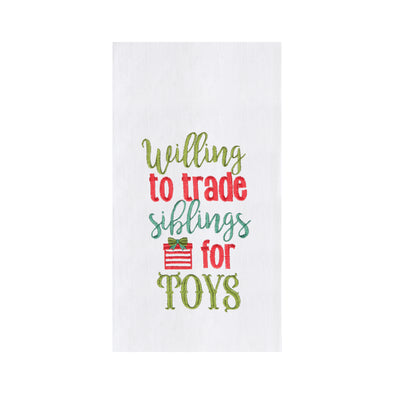 siblings for toys kitchen towel with "willing to trade siblings for toys" written in red, green, and teal with a present