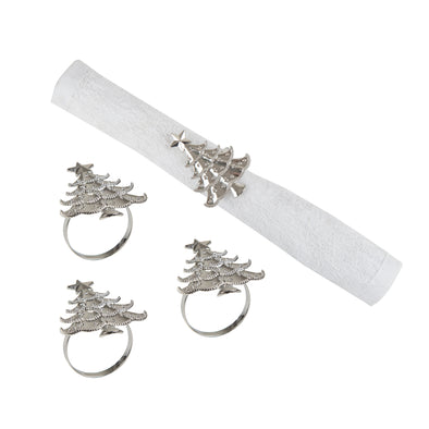 silver napkin rings shaped like Christmas trees - one wrapped around a white napkin