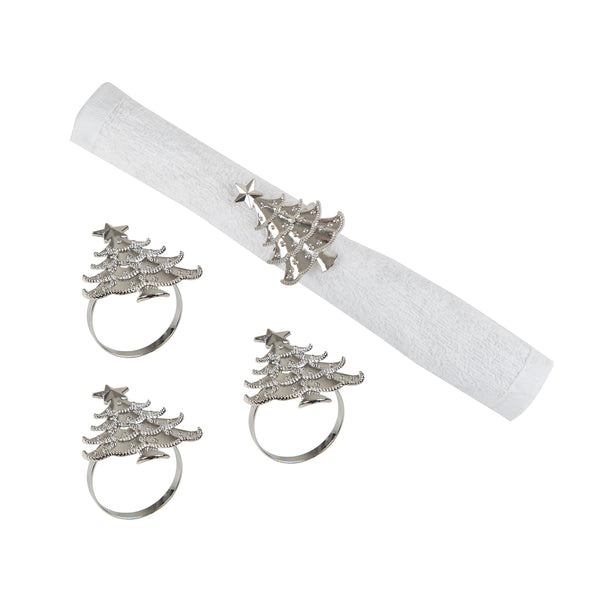 silver napkin rings shaped like Christmas trees - one wrapped around a white napkin