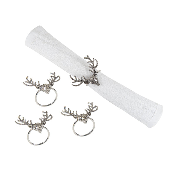 silver napkin rings shaped like deer buck heads with antlers - one wrapped around a white napkin