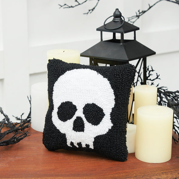 Skull Mini Hooked Pillow styled on a Halloween themed side table.