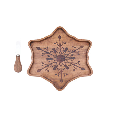 snowflake shaped serving board made from acacia wood with a spreader