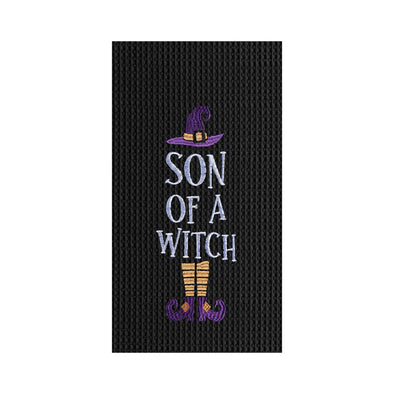 black embroidered waffle weave kitchen towel with the phrase Son of a Witch in the center surrounded by a witches' hat and legs