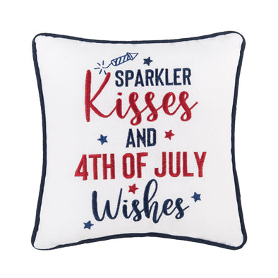 embroidered pillow with the phrase sparkler kisses and 4th of July wishes in red and blue text complemented by tiny stars and a sparkler