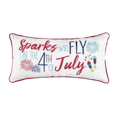 an embroidered pillow trimmed in red with the phrase sparks will fly on the 4th of july surrounded by bursting fireworks and sparklers