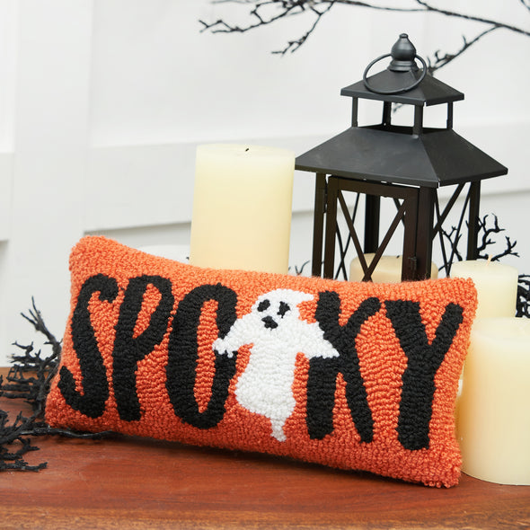 Spooky Ghost Hooked pillow styled on a Halloween themed side table
