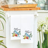 spread happiness kitchen towel hanging in a kitchen