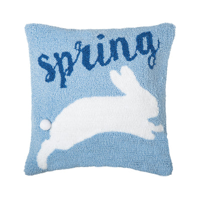 light blue hooked pillow with the word "spring" in dark blue with a bunny jumping across the pillow