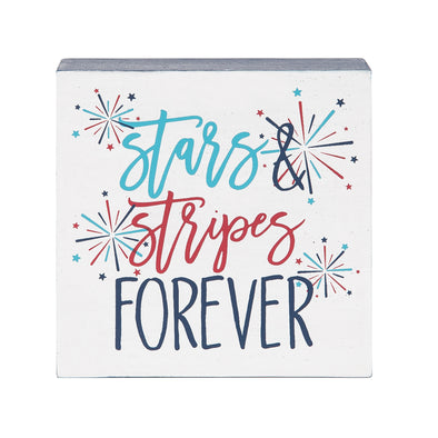 shelf block with the words stars & stripes forever in a flourishing text surrounded by bursting fireworks in red and blue