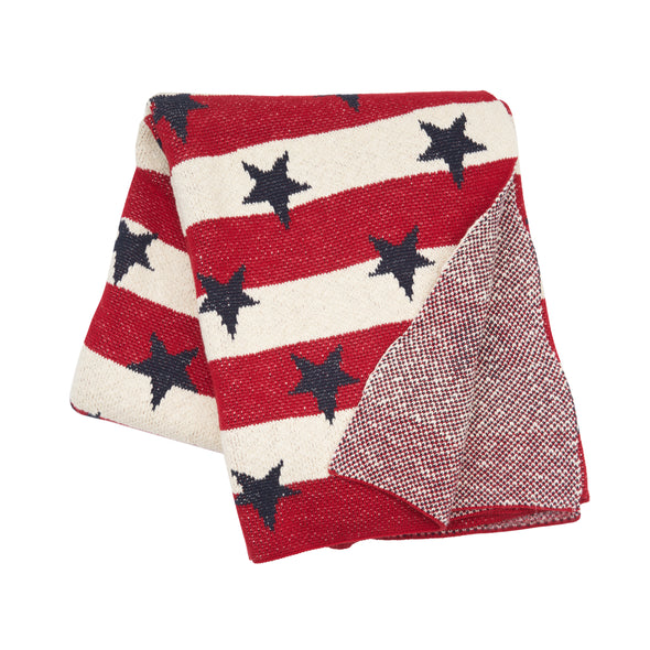 knitted throw with red and white stripes and navy blue stars