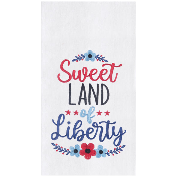 flour sack towel with the words sweet land of liberty surrounded by floral and botanical motifs in red and shades of blue