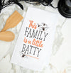 This Family is a Little Batty kitchen towel styled on a marble countertop.