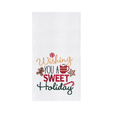 embroidered flour sack towel with the phrase wishing you a sweet holiday surrounded by classic Christmas sweets including a gingerbread man, peppermint candy, hot cocoa, and candy cane