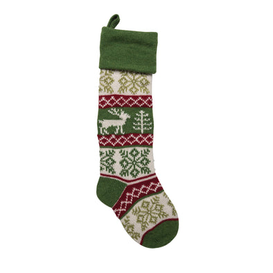 knit stocking with a deer and snowflake pattern in red white and green