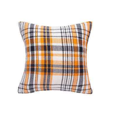 orange white and black woven pillow